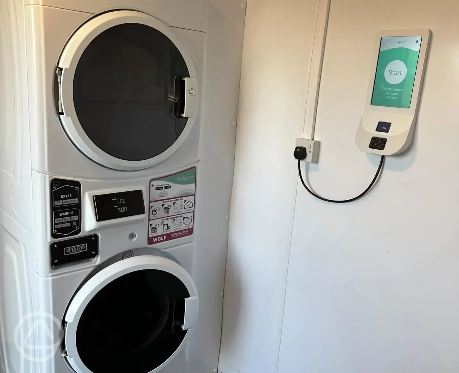 Laundry room with card-operated washing machines and tumble dryers