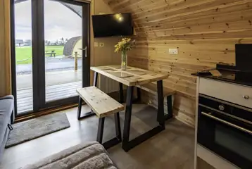 Mega glamping pod dining area for four people