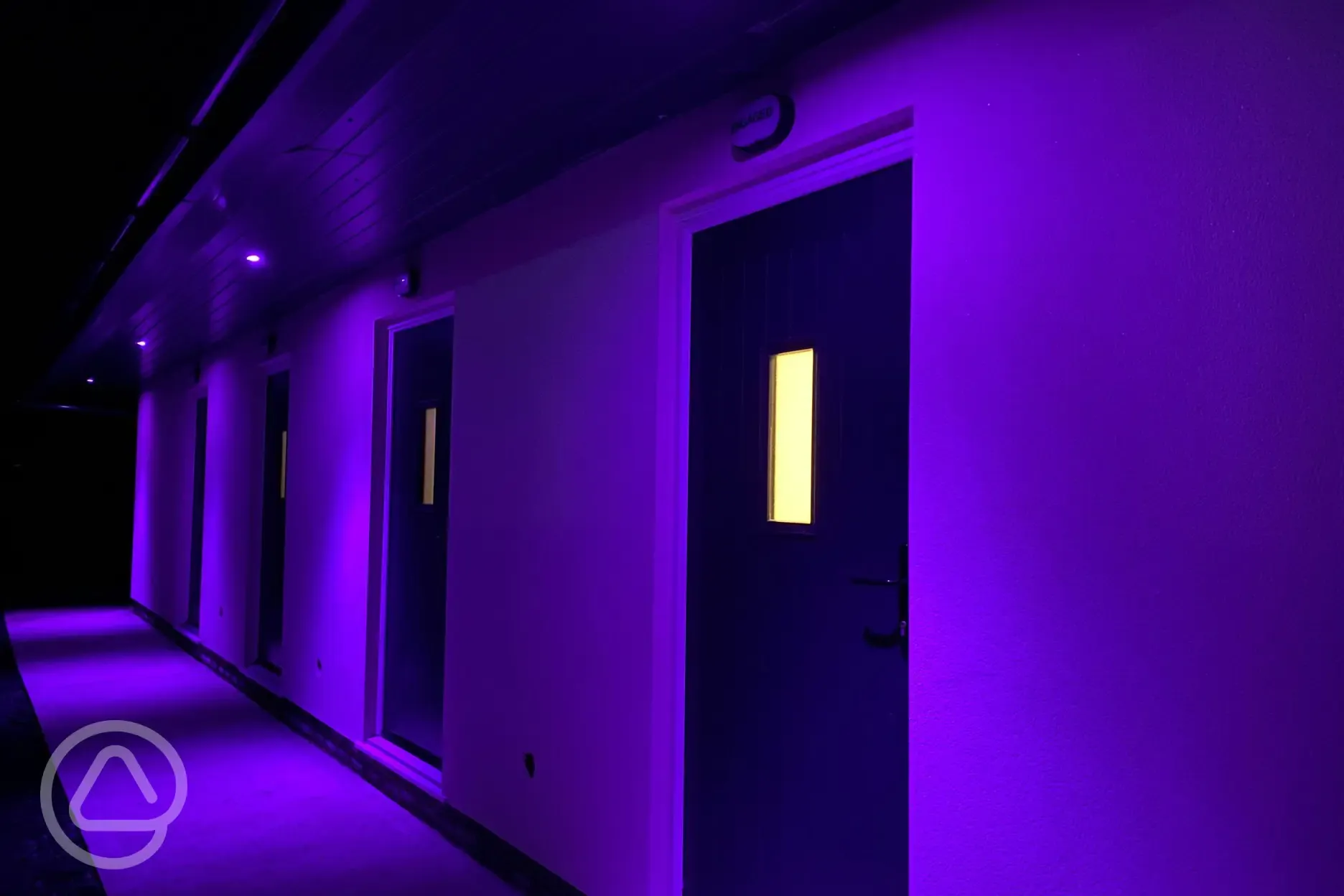 Facilities block lit up at night 