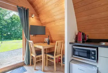 Bunny ensuite glamping pod dining area and TV Bunny ensuite glamping pod dining area and TV