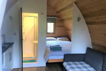Ensuite glamping pod - interior with a double bed and sofa bed Ensuite glamping pod - interior with a double bed and sofa bed