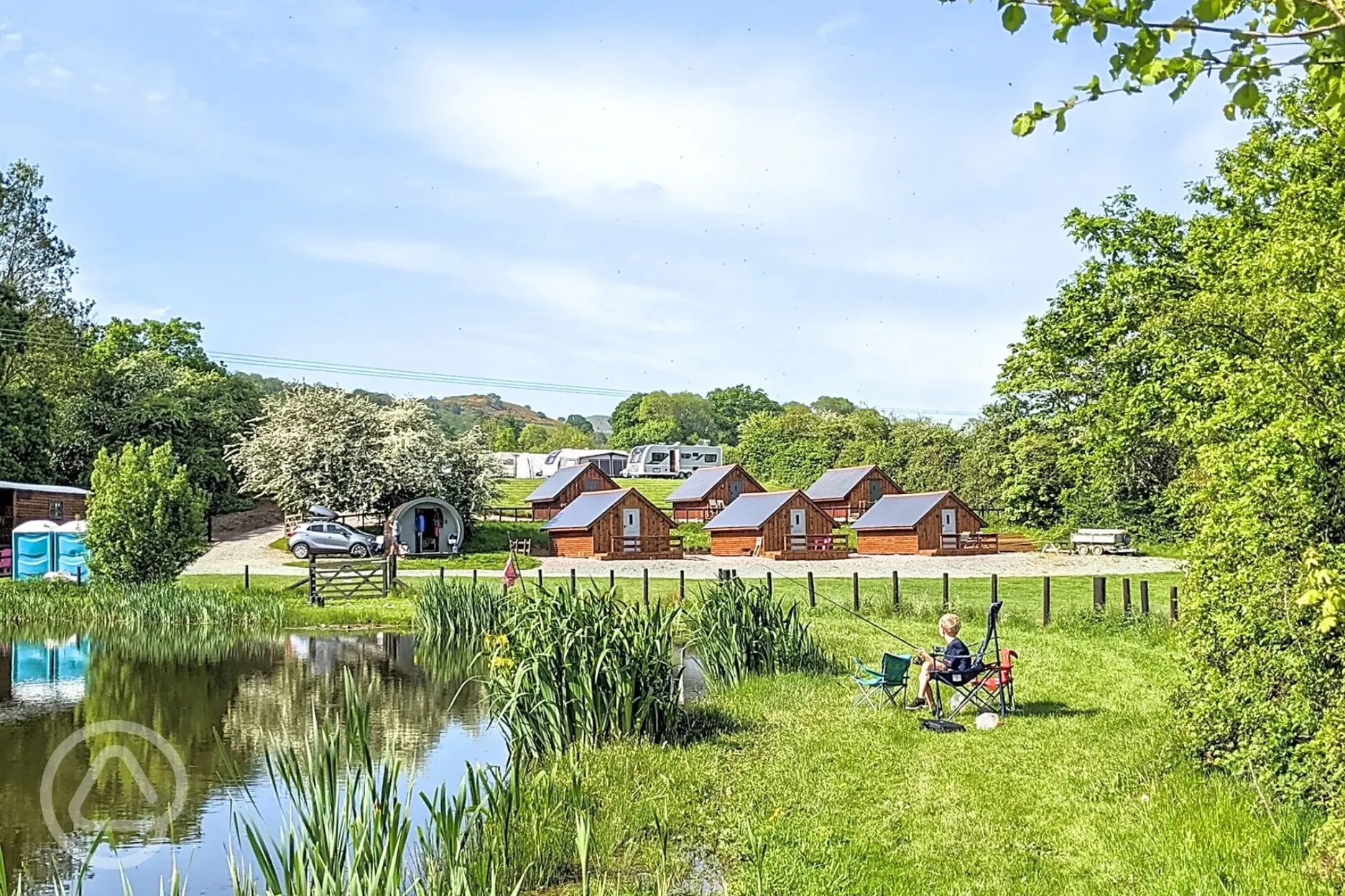 Glamping lodges around the onsite fishing pool (extra cost)