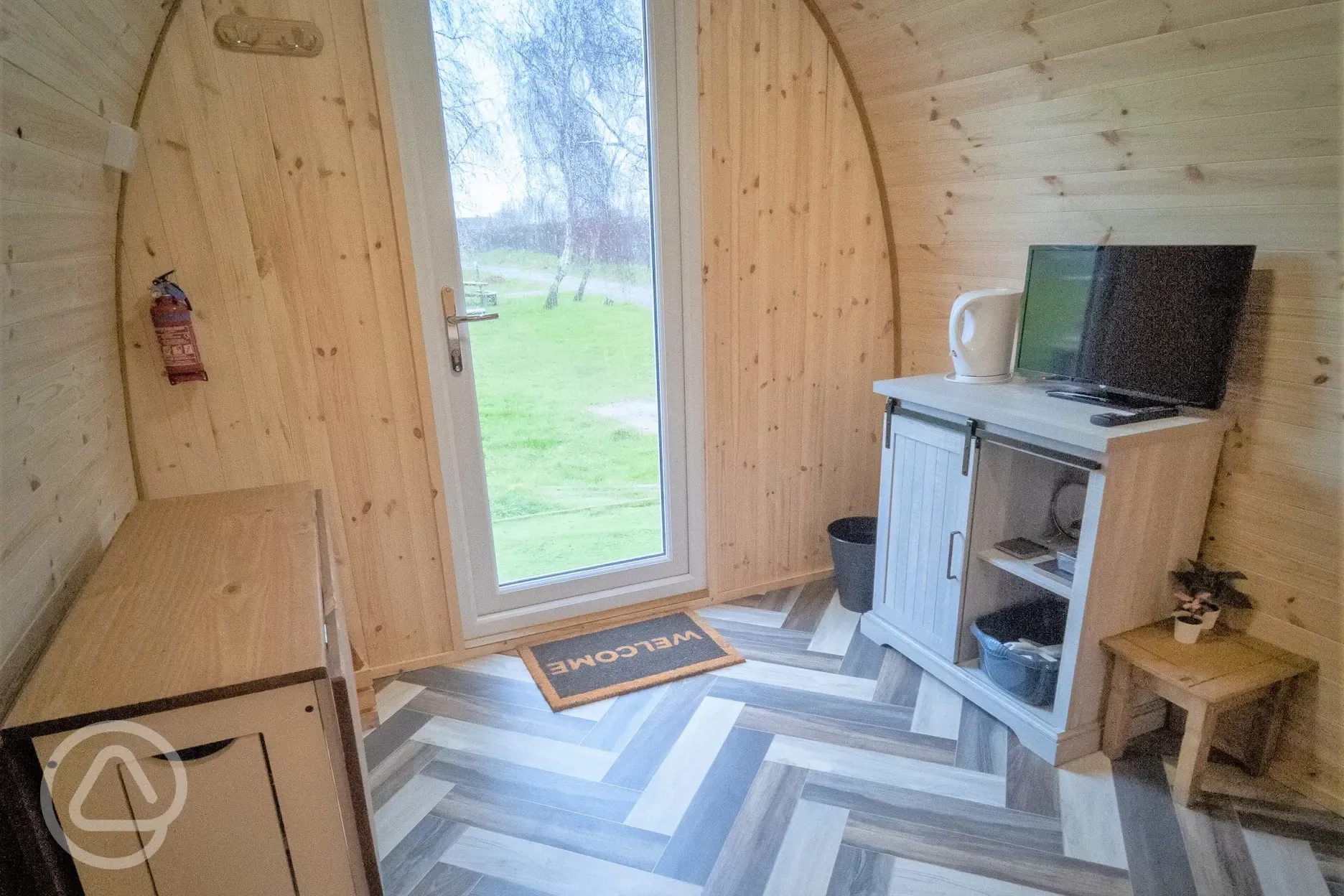 Family camping pod interior with a TV