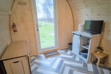 Family camping pod interior with a TV