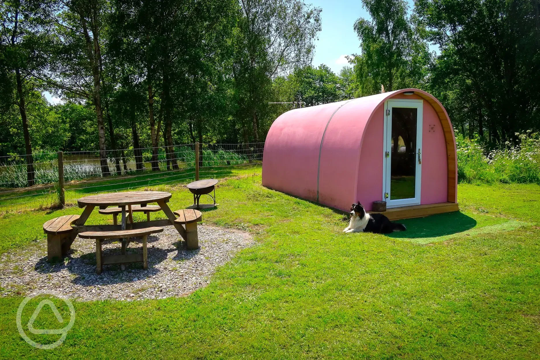 Alder camping pod with a picnic table and fire pit