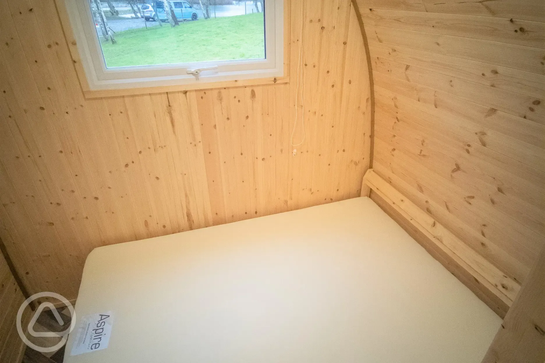 Family camping pod interior with a double bed (bring own bedding)