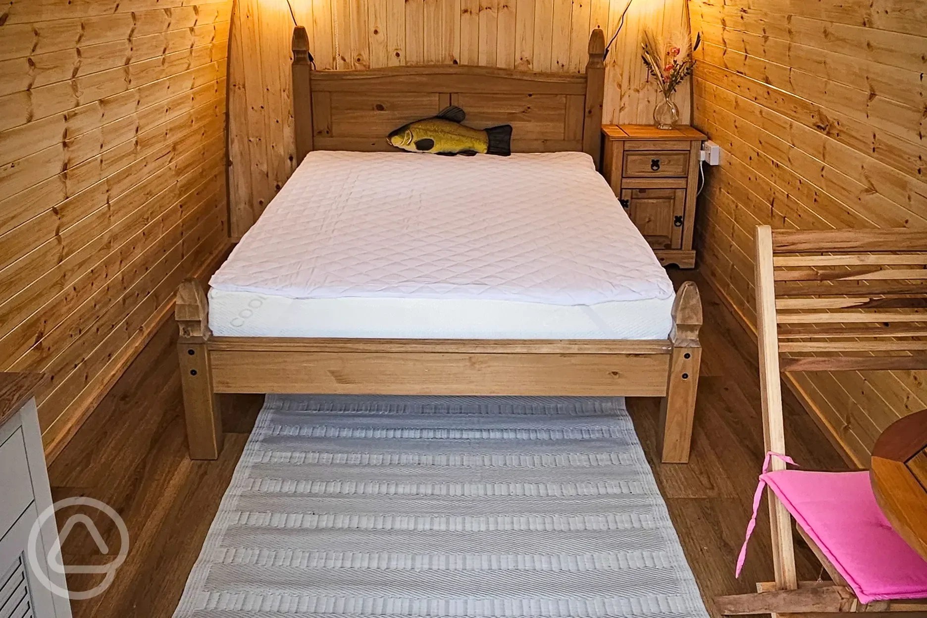 Alder camping pod interior with a double bed (bring own bedding)