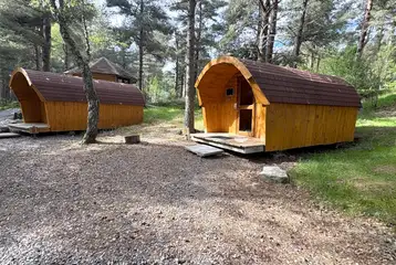 Four person camping pod exterior with private decking Four person camping pod exterior with private decking