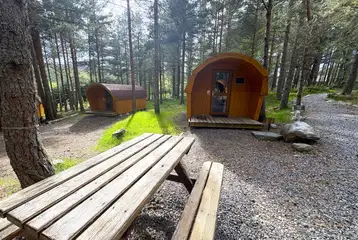 Picnic bench outside a camping pod Picnic bench outside a camping pod