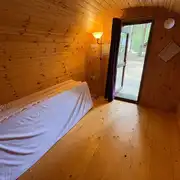 Four person camping pod interior with four single mattresses Four person camping pod interior with four single mattresses