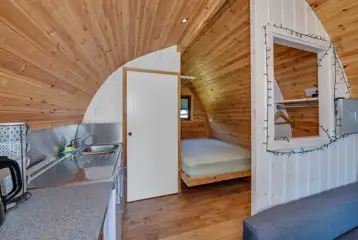 Ensuite Cosy glamping pod double bed and kitchen area Ensuite Cosy glamping pod double bed and kitchen area