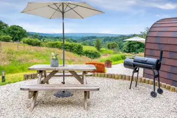 Wild Thyme pod outdoor area with countryside views