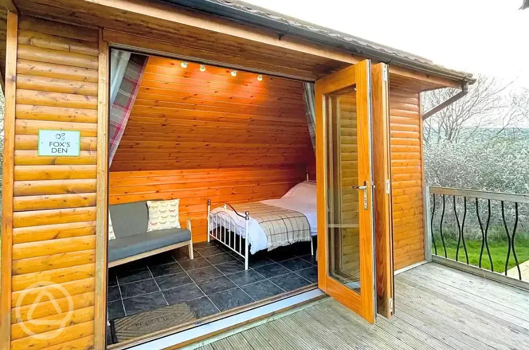 Mini lodge pod interior with double bed