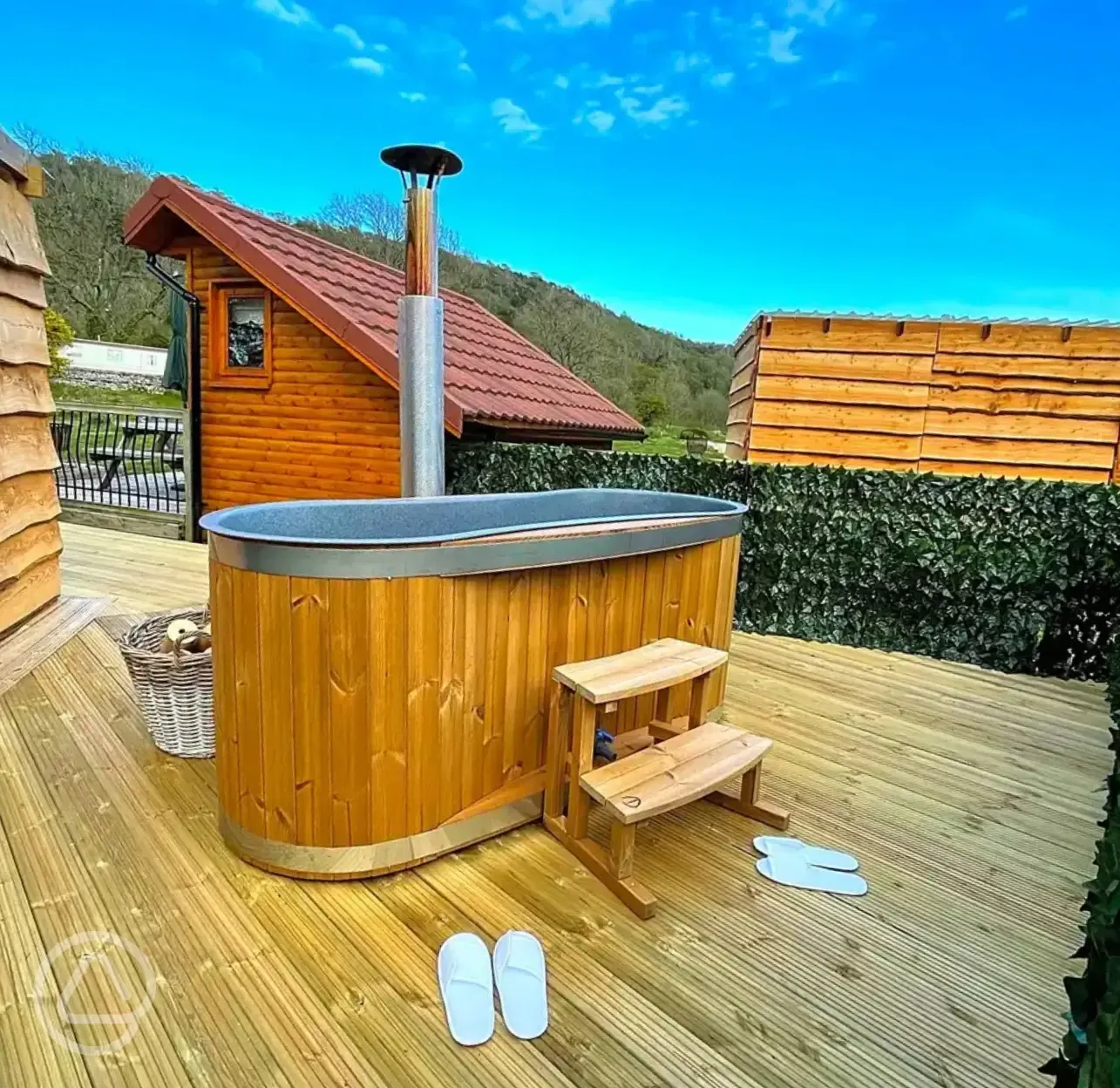 Mini lodge pod with hot tub on private decking area