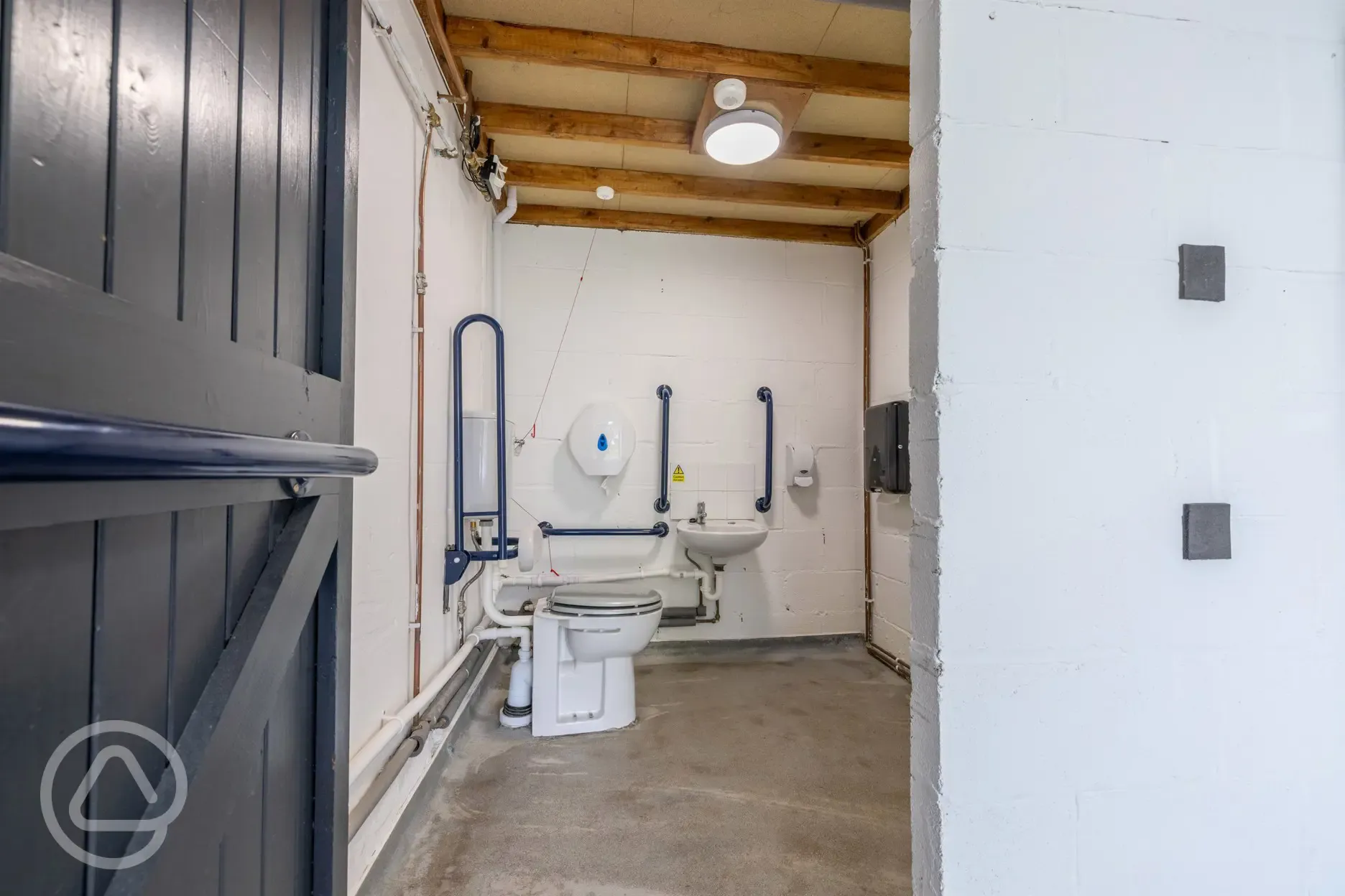 Disabled facilities with handrails, sink and hand dryer