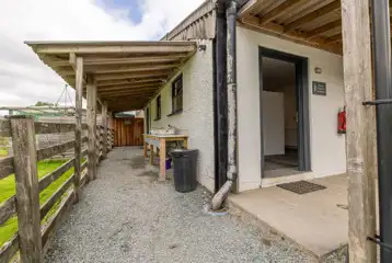 Facilities block exterior with washing up area Facilities block exterior with washing up area