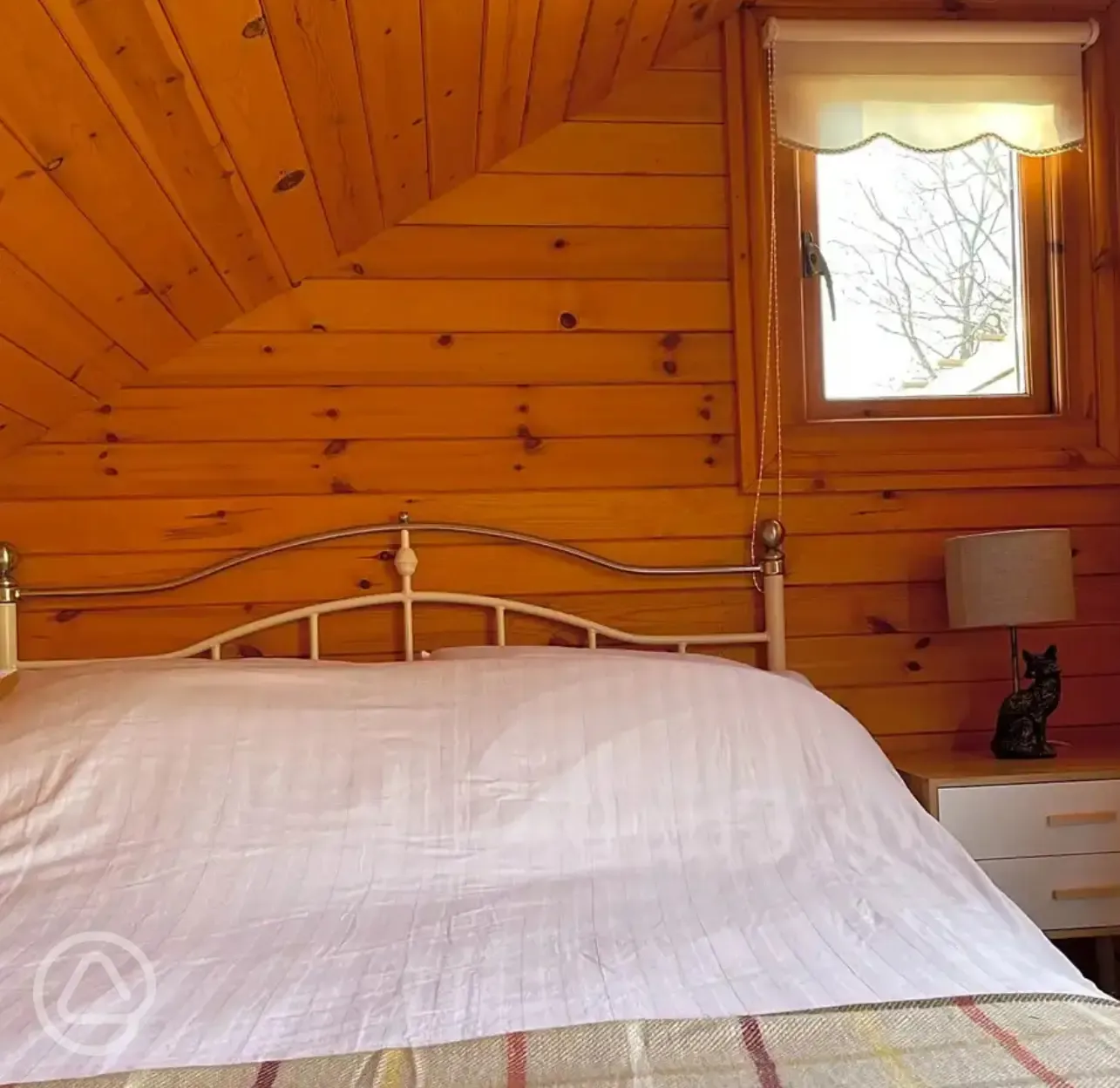 Mini lodge pod interior with double bed