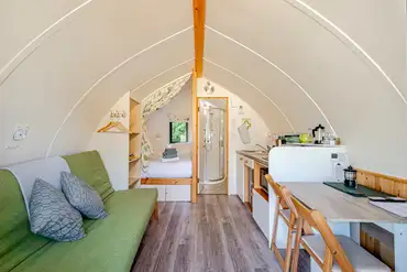 The Rushy Lot pod with a king size bed, sofa bed, kitchen and ensuite