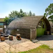 Humbleton accessible glamping pod with wheelchair access, a fire pit and hot tub