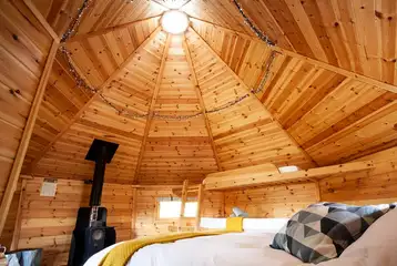 Glamping cabin interior with a wood burner Glamping cabin interior with a wood burner
