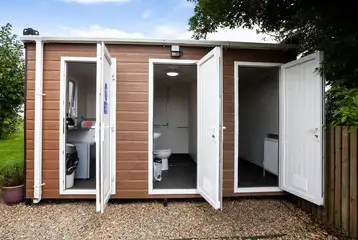 Onsite shared washroom facilities for standard glamping cabins Onsite shared washroom facilities for standard glamping cabins