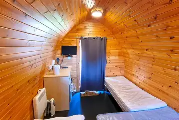 Camping pods with a double bed, twin beds, fridge, kettle, heating and TV