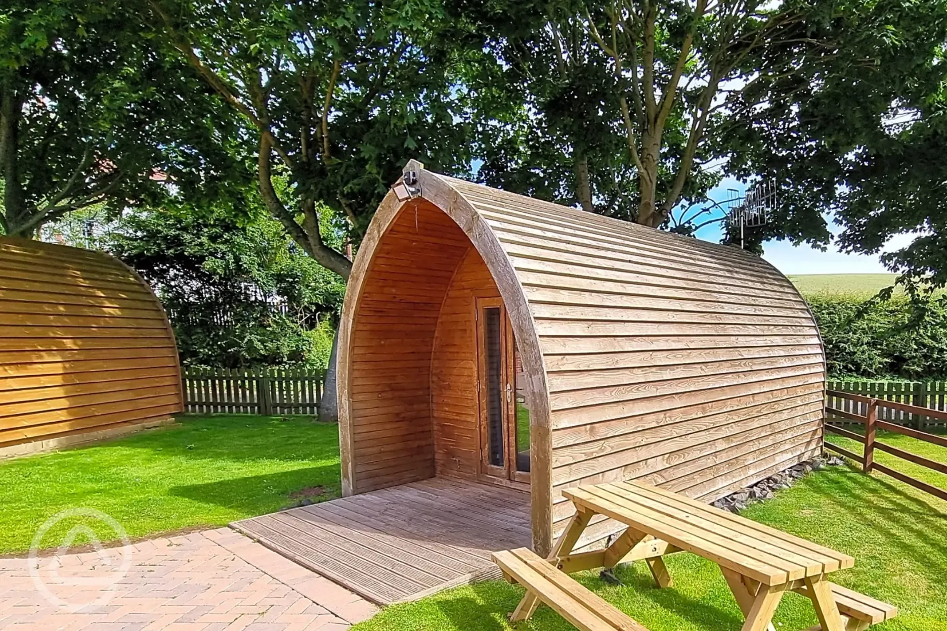 Camping pod with a private outdoor picnic bench