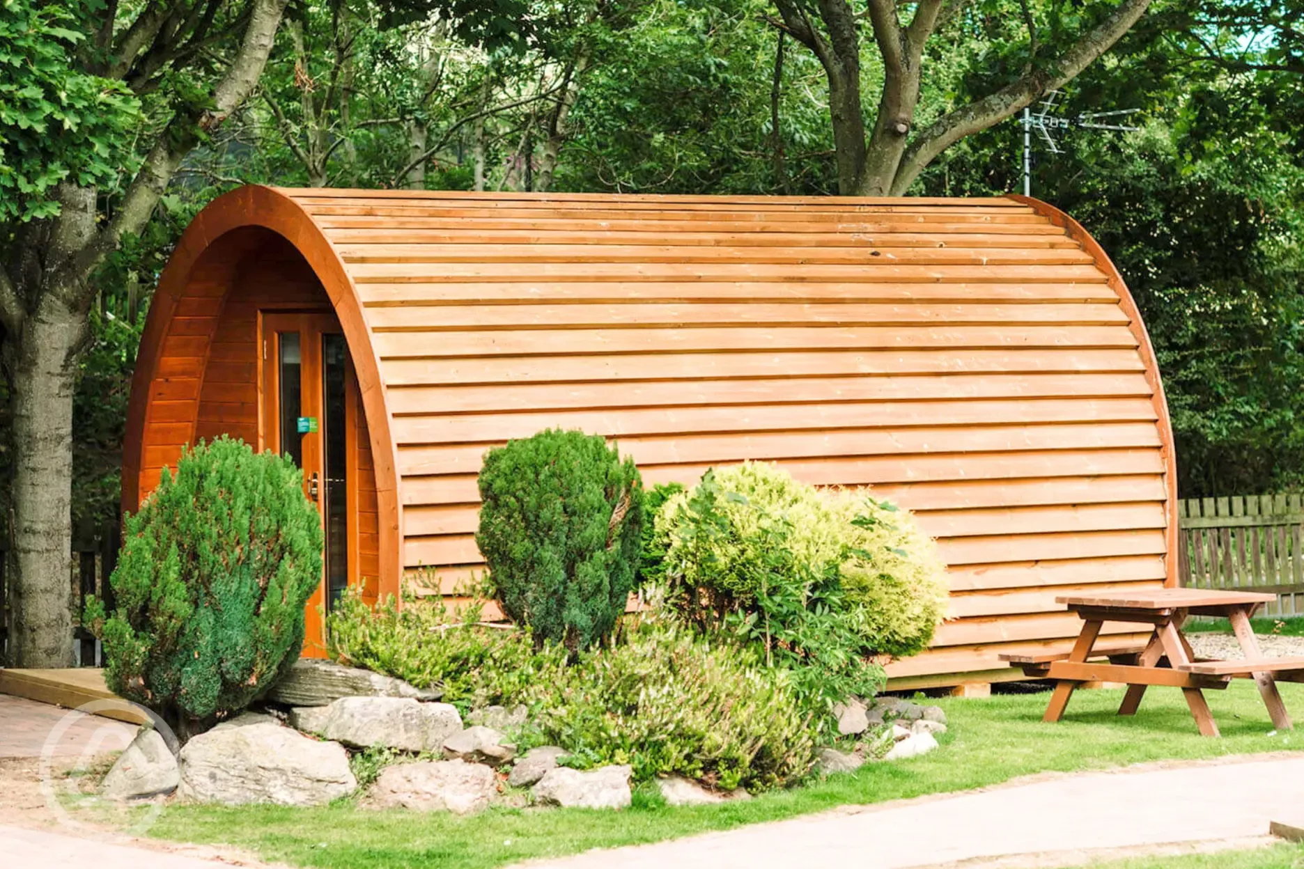 Camping pod with planting around the site