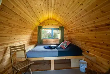 Pod interior with a double bed (bedding and towels included)