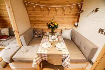 Ensuite glamping pod dining table (converts into a double bed) Ensuite glamping pod dining table (converts into a double bed)
