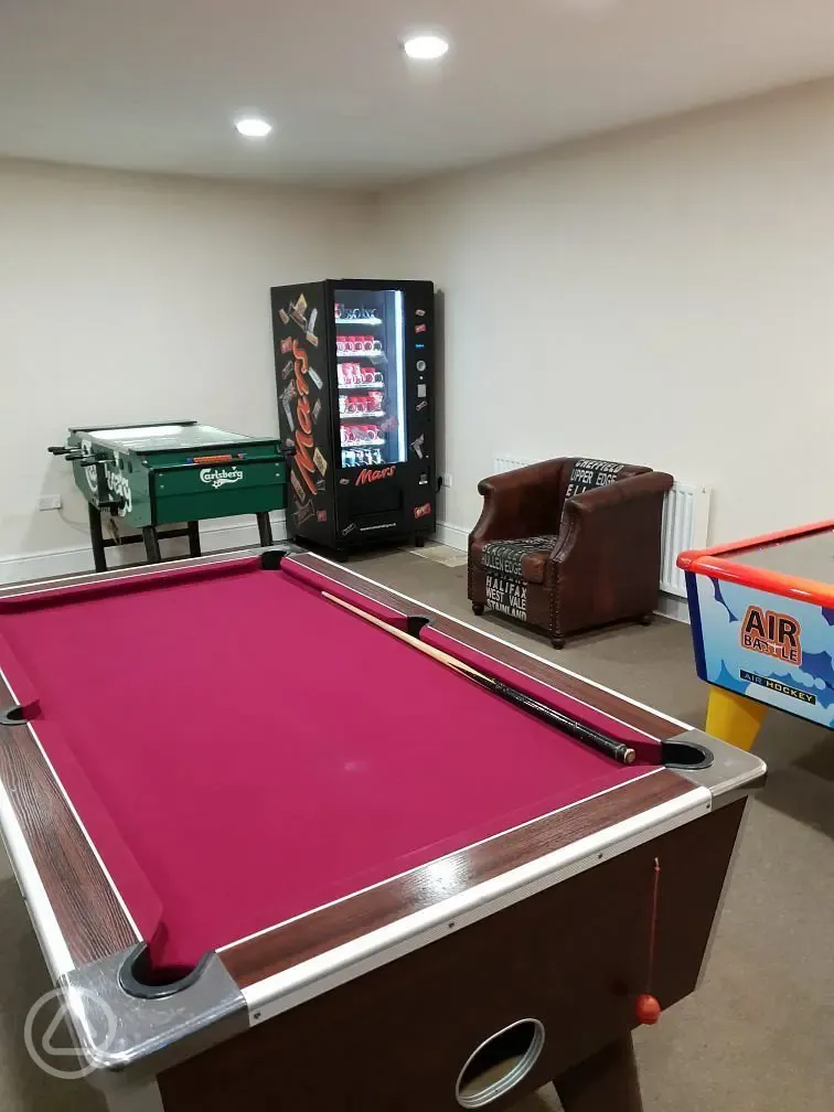 Games room pool and football table and vending machine at Nurseries Caravan Park