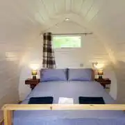 Double bed glamping pod interior