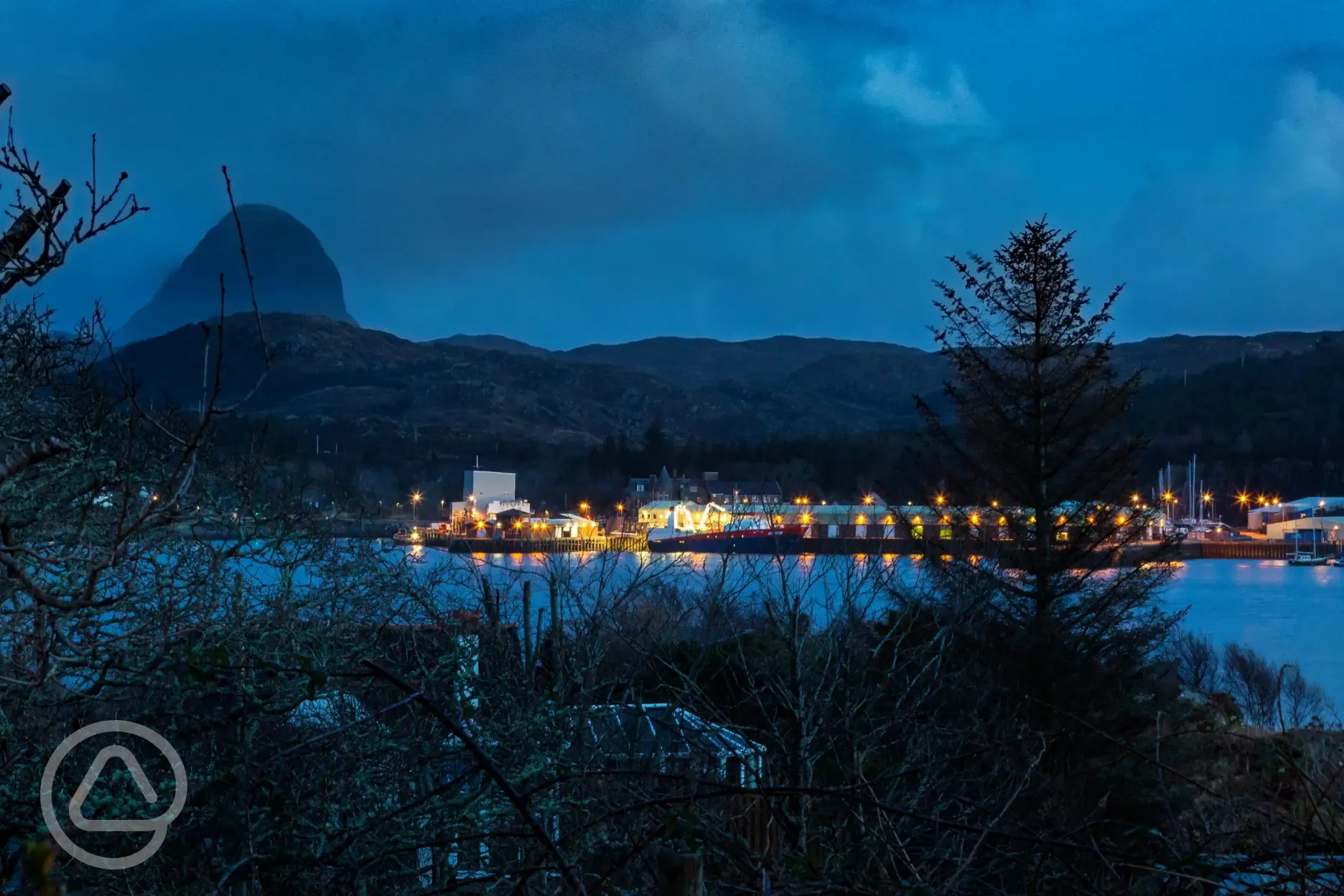 Views of Lochinver and Suilven at night from the pod