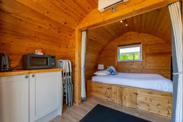 Camping pods with a double bed, kitchen unit and sofa bed Camping pods with a double bed, kitchen unit and sofa bed