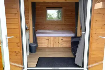 Camping pod interior with a double bed (bring own bedding) Camping pod interior with a double bed (bring own bedding)