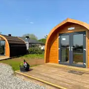Camping pods with double doors and wooden decks Camping pods with double doors and wooden decks