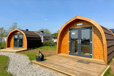 Camping pods with double doors and wooden decks