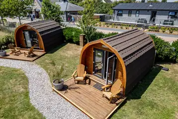 Camping pods with a deck area with table and chairs Camping pods with a deck area with table and chairs