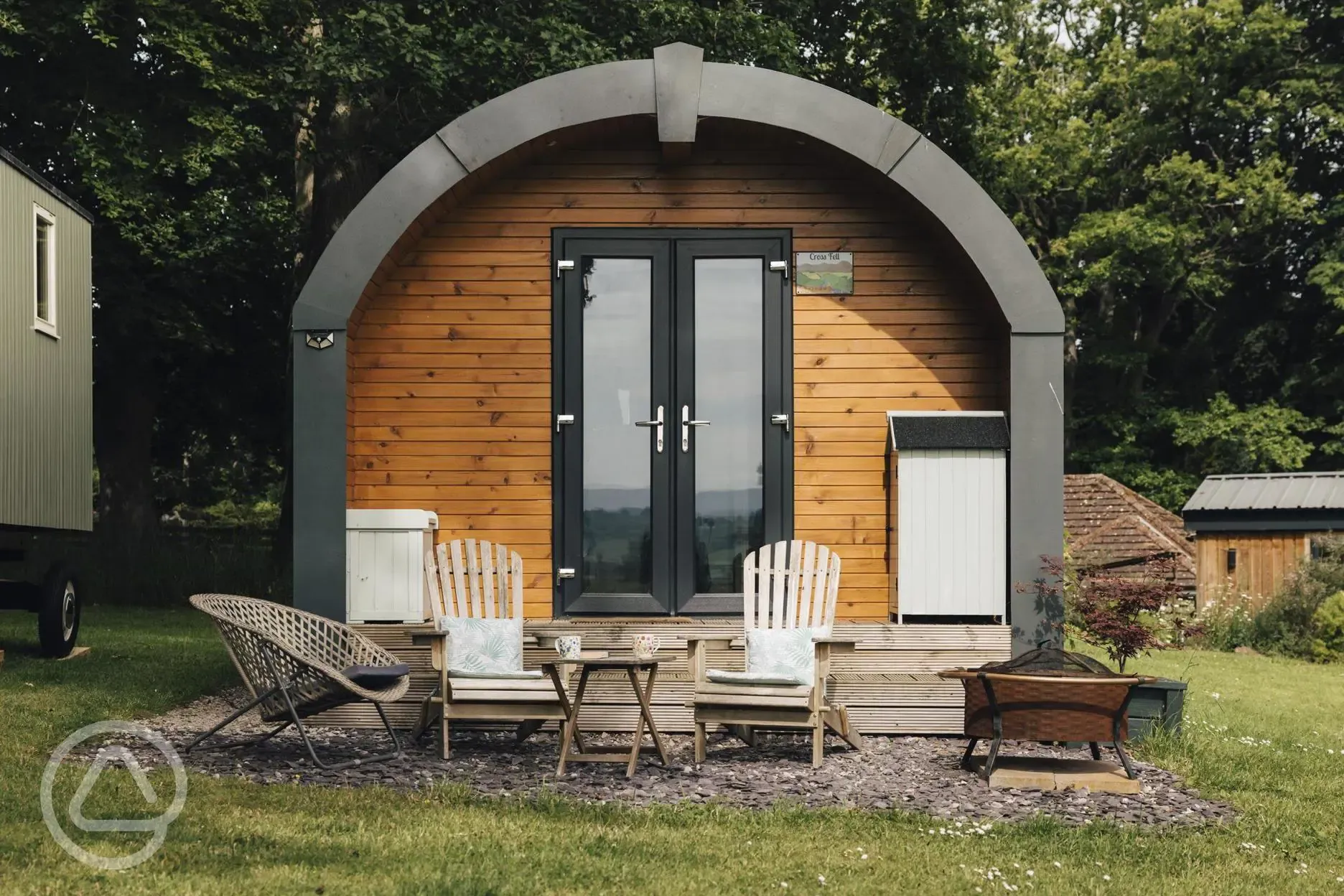Cross Fell pod outdoor seating and fire pit at Eden Valley Glamping