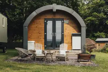 Cross Fell pod outdoor seating and fire pit at Eden Valley Glamping Cross Fell pod outdoor seating and fire pit at Eden Valley Glamping