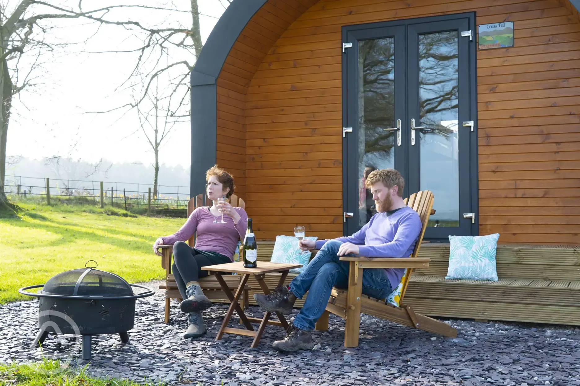 Cross Fell pod outdoor seating and fire pit at Eden Valley Glamping