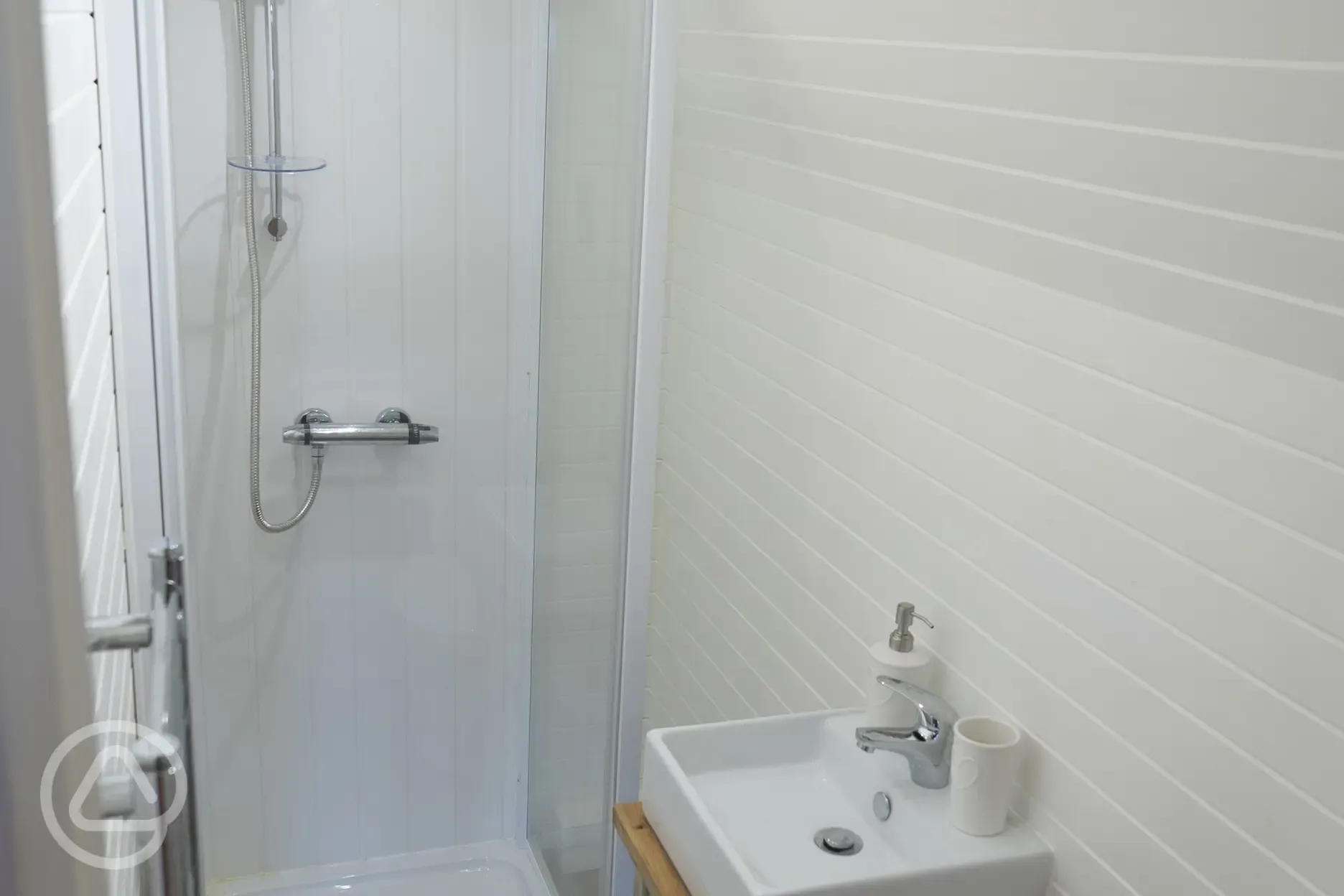 Henrietta Train Carriage ensuite with a shower attachment and heated towel rail