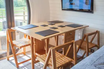 Family glamping pod dining area