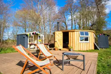 Glamping cabin with a private decking, fire pit, kitchen hut and eco loo