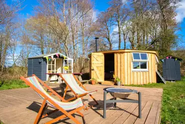 Glamping cabin with a private decking, fire pit, kitchen hut and eco loo