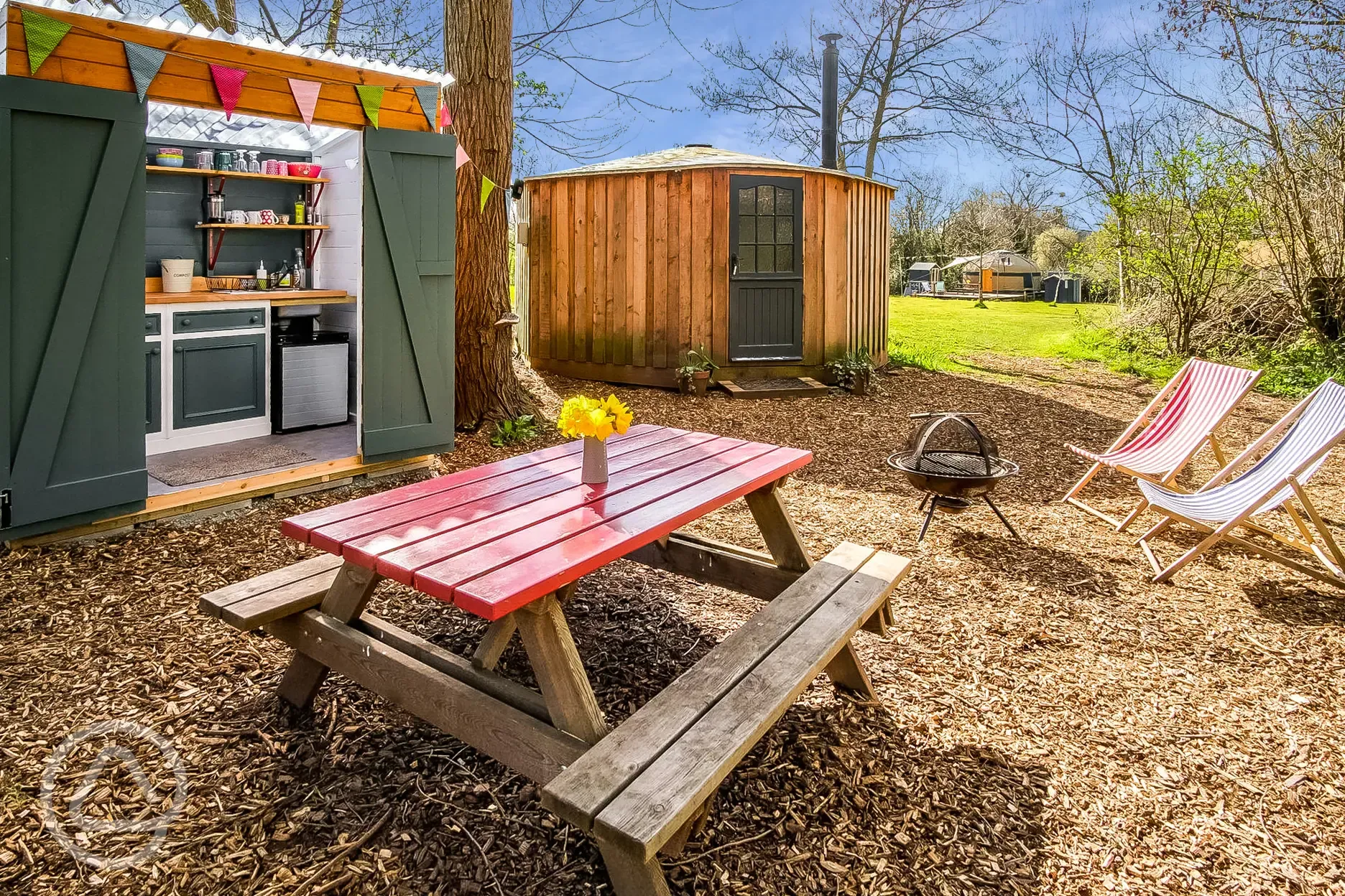 Glamping cabin with a private decking, fire pit, kitchen hut and eco loo