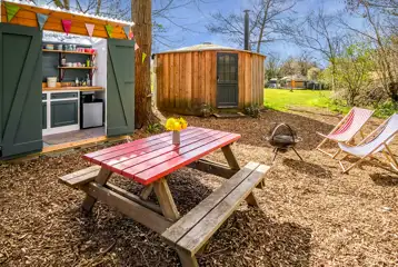 Glamping cabin with a private decking, fire pit, kitchen hut and eco loo