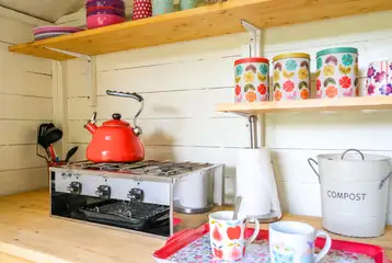 Private equipped kitchen huts with a hob and fridge