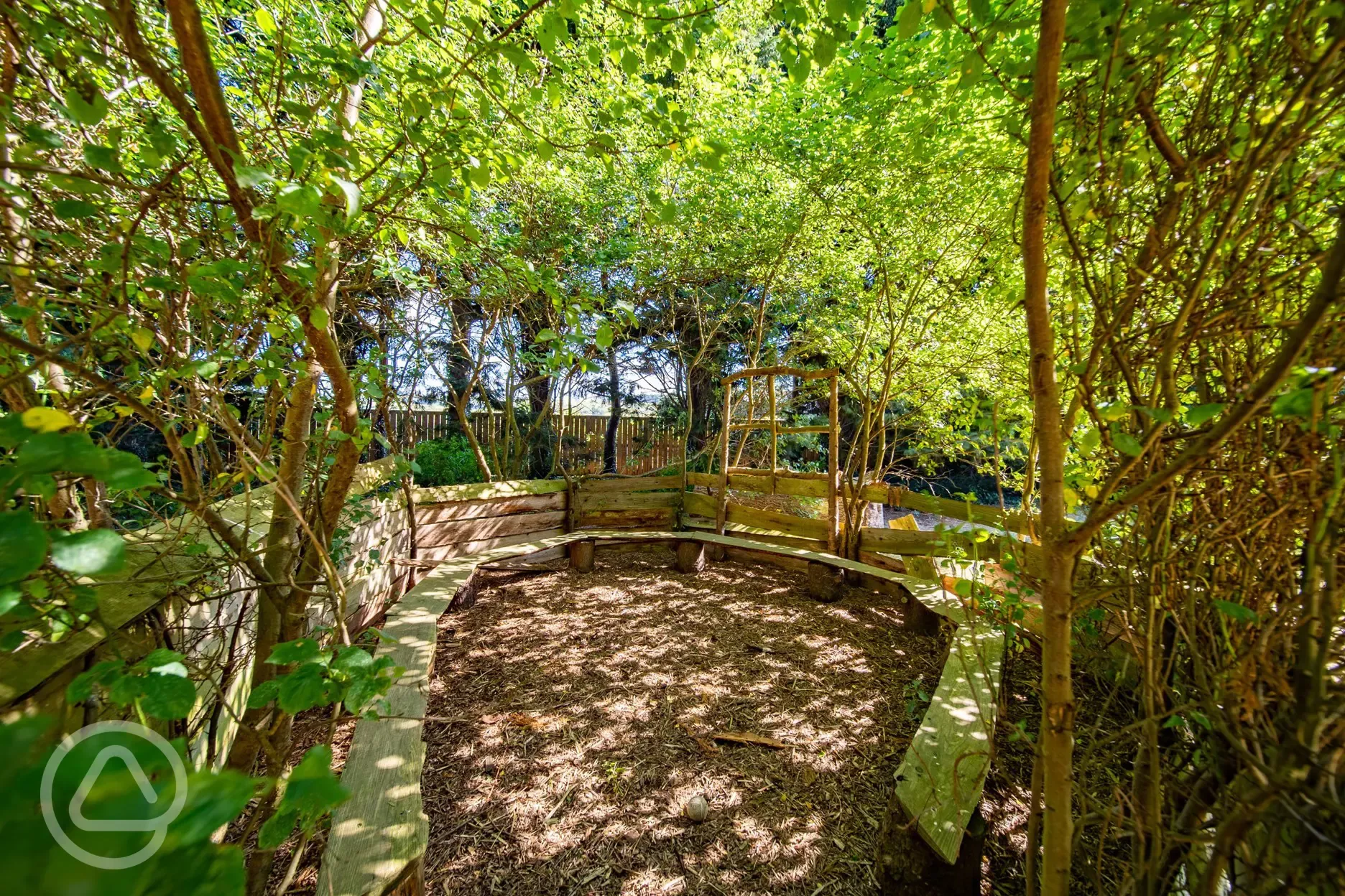 Woodland play area with seating