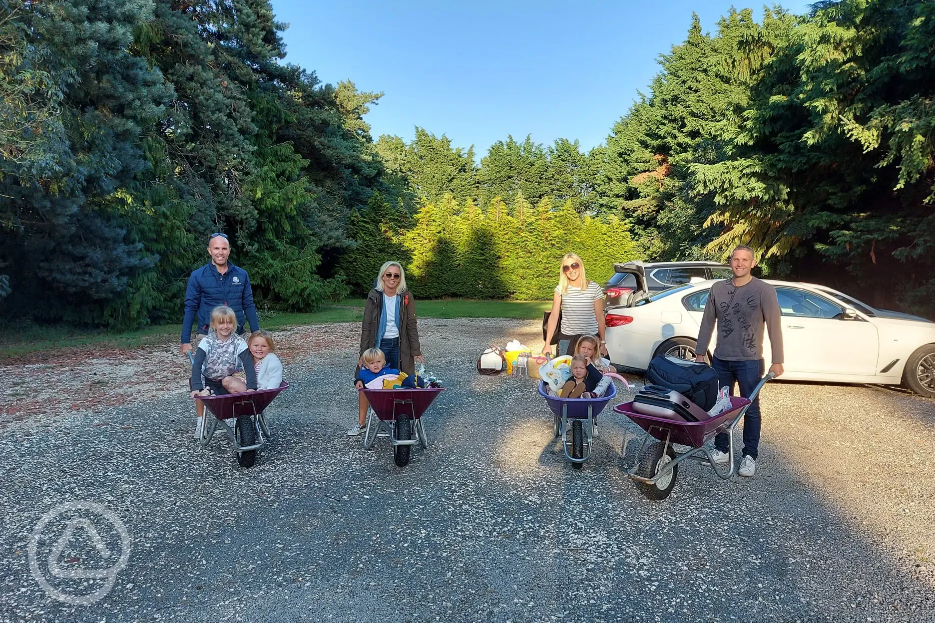 Guests loading gear into wheelbarrows